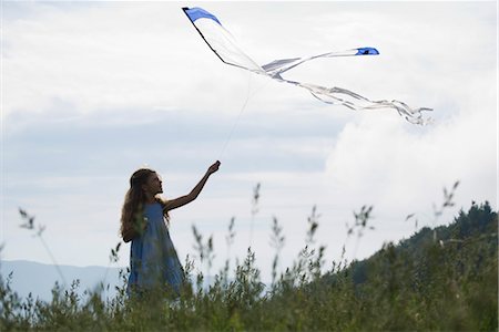 Girl flying kite Stock Photo - Premium Royalty-Free, Code: 632-05760480