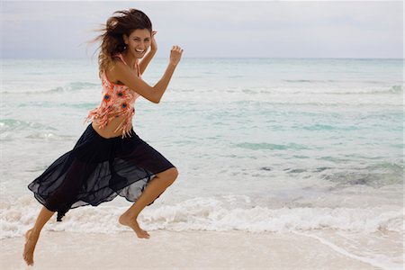 summer light - Woman running at the beach Foto de stock - Sin royalties Premium, Código: 632-05760557