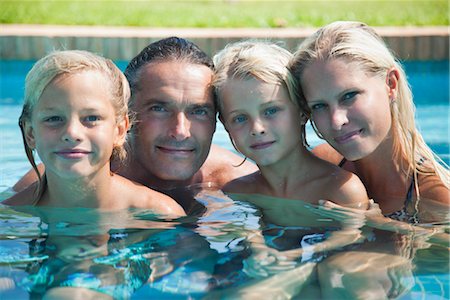Family together in pool, portrait Stock Photo - Premium Royalty-Free, Code: 632-05816361