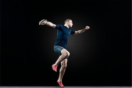 Male athlete throwing discus Stock Photo - Premium Royalty-Free, Code: 632-05816448