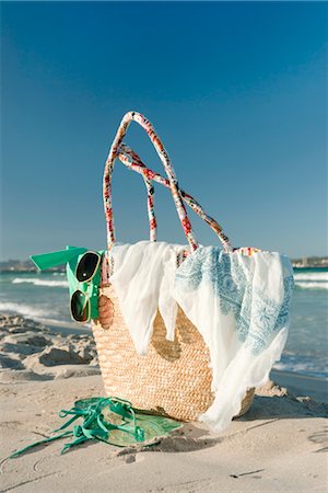 summer holiday shoes - Packed beach bag on beach Stock Photo - Premium Royalty-Free, Code: 632-05816520
