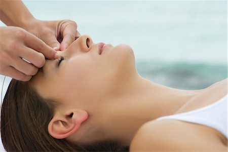 shiatsu - Young woman receiving face massage, side view Stock Photo - Premium Royalty-Free, Code: 632-05816523