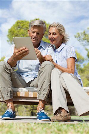 senior couples lifestyle - Couple using digital tablet outdoors Stock Photo - Premium Royalty-Free, Code: 632-05816701
