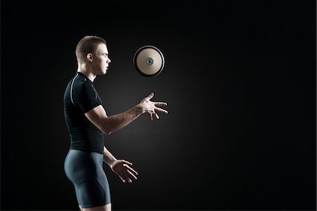 Male athlete throwing discus in air Stock Photo - Premium Royalty-Free, Code: 632-05816991