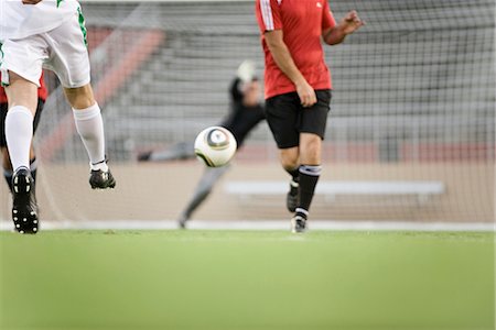 soccer and stadium and teams - Soccer players on field, cropped Stock Photo - Premium Royalty-Free, Code: 632-05817094