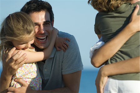 father hugging his son and daughter - Father and daughter embracing outdoors Stock Photo - Premium Royalty-Free, Code: 632-05817149