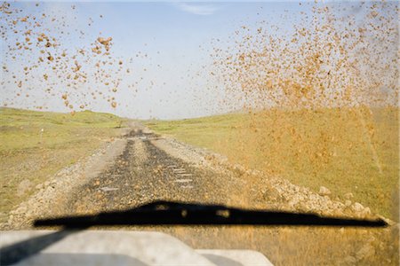 personal perspective - Dirt road viewed through muddy car windshield Stock Photo - Premium Royalty-Free, Code: 632-05845115