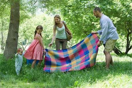 Family preparing for picnic in meadow Stock Photo - Premium Royalty-Free, Code: 632-05845250