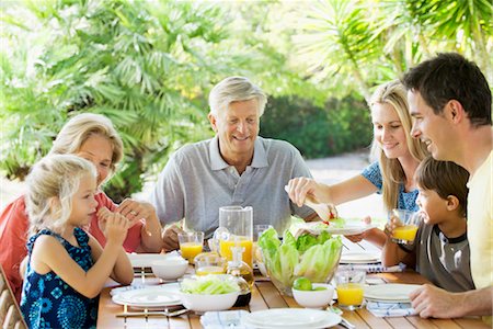 Multi-generation family having breakfast together outdoors Stock Photo - Premium Royalty-Free, Code: 632-05845468