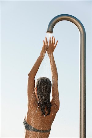 simsearch:632-05991893,k - Woman in bikini top showering outdoors Stock Photo - Premium Royalty-Free, Code: 632-05845525