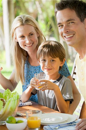 family salad - Boy having meal with parents outdoors, portrait Stock Photo - Premium Royalty-Free, Code: 632-05845709