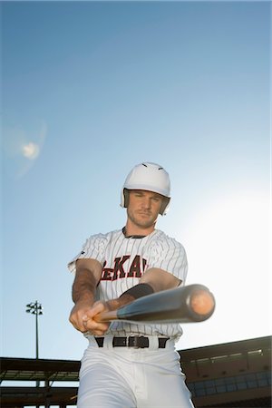 Baseball player swinging bat Stock Photo - Premium Royalty-Free, Code: 632-05991511