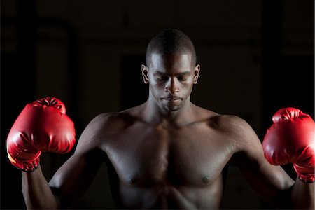 simsearch:632-05991588,k - Boxer in boxing gloves with eyes closed, portrait Stock Photo - Premium Royalty-Free, Code: 632-05991530