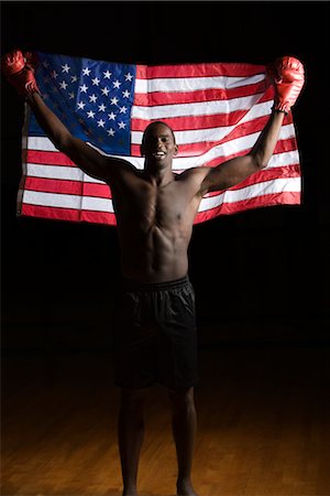 simsearch:632-05991588,k - Boxer holding up American flag, portrait Stock Photo - Premium Royalty-Free, Code: 632-05991692