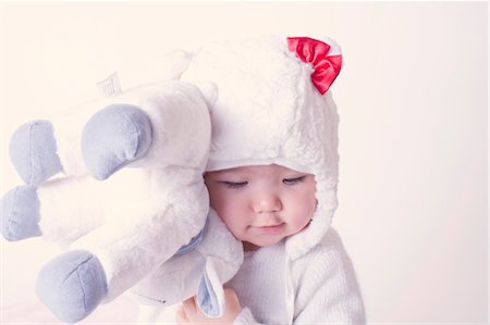 simsearch:632-03027302,k - Baby girl hugging stuffed toy Stock Photo - Premium Royalty-Free, Code: 632-05991979