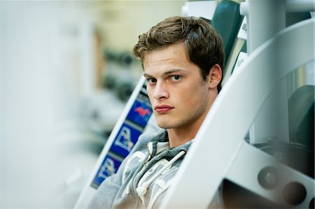 Young man in weight room Stock Photo - Premium Royalty-Free, Code: 632-05991998