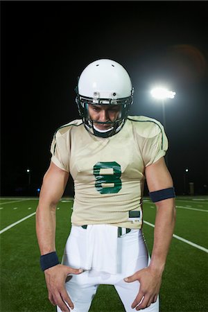 football helmet - Football player on field, portrait Stock Photo - Premium Royalty-Free, Code: 632-05992090