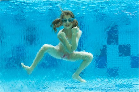 Girl swimming underwater in swimming pool Stock Photo - Premium Royalty-Free, Code: 632-06029562