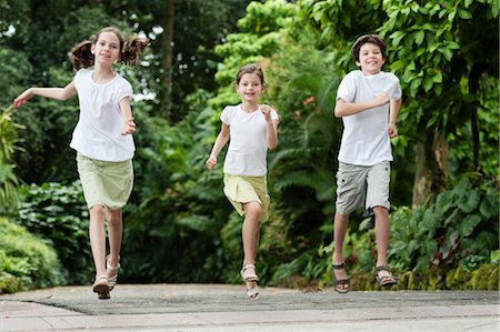 simsearch:632-06029740,k - Children running outdoors Stock Photo - Premium Royalty-Free, Code: 632-06029623