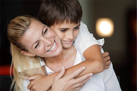 son hugging mom - Boy embracing his mother Stock Photo - Premium Royalty-Free, Code: 632-06118418