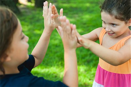 Children playing pattycake Stock Photo - Premium Royalty-Free, Code: 632-06118572