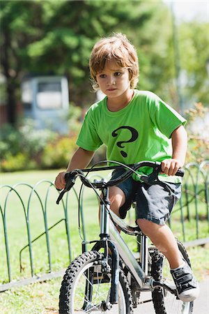 Boy riding bicycle Stock Photo - Premium Royalty-Free, Code: 632-06118780