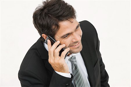 simsearch:632-05400935,k - Businessman talking on cell phone Stock Photo - Premium Royalty-Free, Code: 632-06317275