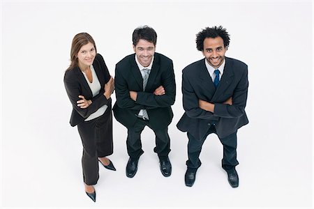 silhouettes cheerful people - Executives standing together with arms folded, portrait Stock Photo - Premium Royalty-Free, Code: 632-06317329