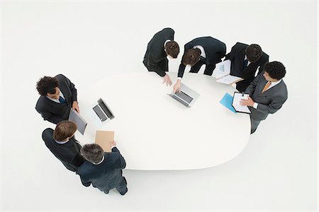 full body cast - Business associates working together in groups around table Stock Photo - Premium Royalty-Free, Code: 632-06317373