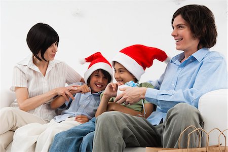 simsearch:693-06435898,k - Family celebrating Christmas together Stock Photo - Premium Royalty-Free, Code: 632-06317526