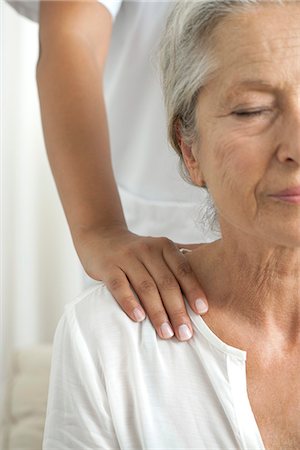 physiotherapist - Senior woman getting a shoulder massage, cropped Stock Photo - Premium Royalty-Free, Code: 632-06317845