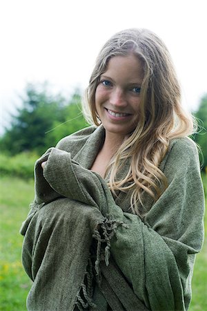 Young woman wrapped in blanket, portrait Stock Photo - Premium Royalty-Free, Code: 632-06318003