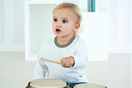 drum (instrument) - Baby boy playing drums Stock Photo - Premium Royalty-Free, Code: 632-06354215