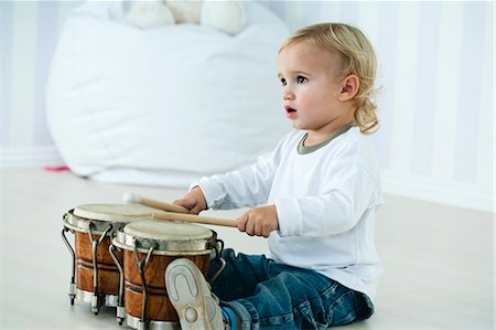 rhythm - Baby boy playing drums Stock Photo - Premium Royalty-Free, Code: 632-06354392