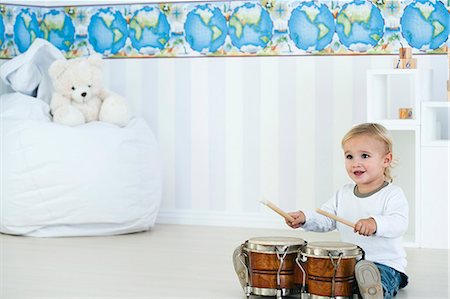 drum (instrument) - Baby boy playing drums in nursery Stock Photo - Premium Royalty-Free, Code: 632-06354414