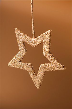 star shape background - Golden star shaped Christmas ornament Stock Photo - Premium Royalty-Free, Code: 632-06404366