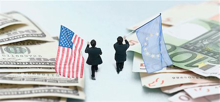 euro - Businessmen marching between piles of money, carrying American and European Union flags Stock Photo - Premium Royalty-Free, Code: 632-06404686