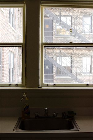 fire escape - To a window on a fire escape U.S. Stock Photo - Premium Royalty-Free, Code: 632-06404751