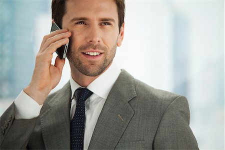 simsearch:632-05400935,k - Businessman using cell phone, portrait Stock Photo - Premium Royalty-Free, Code: 632-06967542