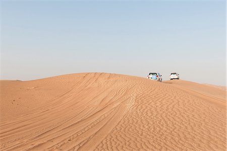 dune driving - Sports utility vehicles driving across desert Stock Photo - Premium Royalty-Free, Code: 632-07161275