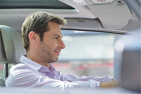 driving (vehicle) - Man driving car, smiling Stock Photo - Premium Royalty-Free, Code: 632-07161434