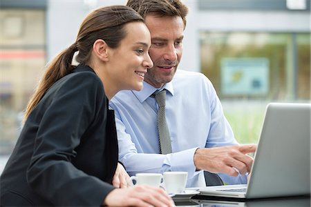 productivity - Business associates working together using laptop computer outdoors Stock Photo - Premium Royalty-Free, Code: 632-07161464