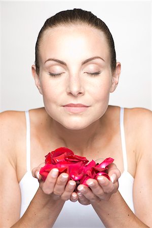 petal - Woman holding rose petals in cupped hands, portrait Stock Photo - Premium Royalty-Free, Code: 632-07494957