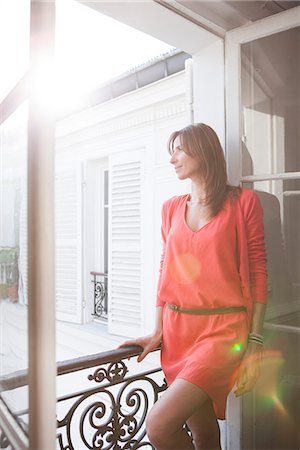 simsearch:632-05845617,k - Woman on balcony looking at view Stock Photo - Premium Royalty-Free, Code: 632-07539862