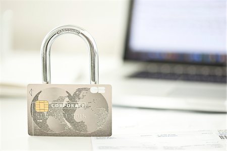 Credit card and lock representing internet security Stock Photo - Premium Royalty-Free, Code: 632-07539949