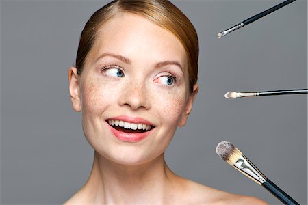 simsearch:693-06022101,k - Young woman with make-up brushes Stock Photo - Premium Royalty-Free, Code: 632-07539965