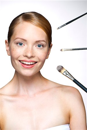 simsearch:693-06022101,k - Young woman with make-up brushes Stock Photo - Premium Royalty-Free, Code: 632-07539966