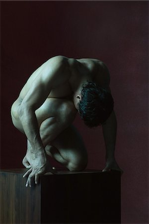 Nude man crouching, head down Stock Photo - Premium Royalty-Free, Code: 632-07539975