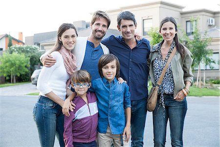 simsearch:632-05816381,k - Family posing together on suburban street, portrait Stock Photo - Premium Royalty-Free, Code: 632-07849451