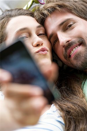 simsearch:632-07674444,k - Young couple taking selfie with smartphone Stock Photo - Premium Royalty-Free, Code: 632-07849467